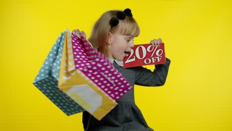 Pupil-blonde-girl-with-shopping-bags-showing-20-percent-Off-banner-text-advertisement.-Holiday-sale