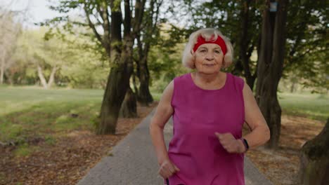 Senior-runner-woman-training-outside,-enjoying-nature.-Workout-cardio-at-morning.-Healthy-lifestyle