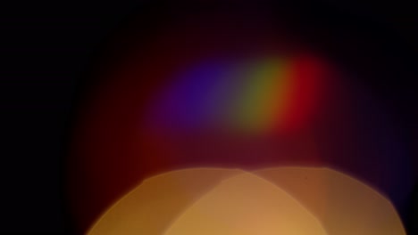 Multicolored-light-leaks-4k-footage-on-black-background.-Stylizing-video,-transitions.-Bokeh-effect