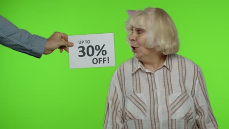 Inscription-Up-To-30-Percent-Off-appears-next-to-grandmother.-Woman-celebrating-with-shopping-bags