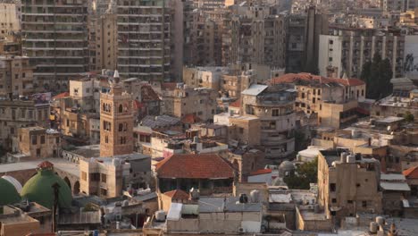 aerial-panning-view-of-old-arab-town-with-mosque-and-minaret-in-Tripoli,-Northern-Lebanon