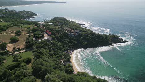 Puerto-Escondido-Mexico-Oaxaca-Aerial-footage-of-coastline-tropical-beach-famous-for-waves-and-surf