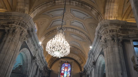 Grand-Chandelier-and-Stained-Glass-in-Cathedral-Interior