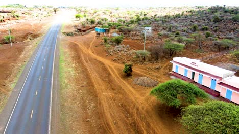 Birdseye-aerial-view-of-rural-roads-in-Kenya,-shanty-poor-neighborhood-of-Loitokitok,-Kenya