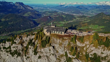 Aerial-view-of-the-Eagles-Nest-in-Bavarian-Alps-against-stunning-mountain-backdrop