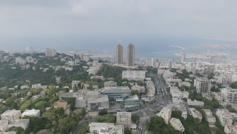 Aerial-rotation-around-high-rise-buildings-on-Mount-Carmel-in-Haifa,-Israel