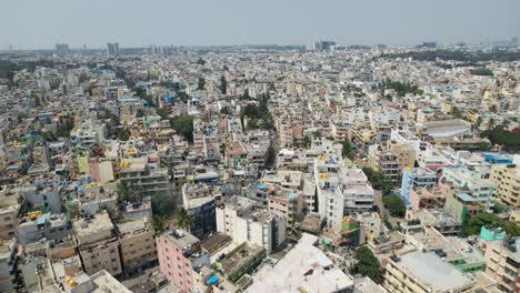 Bengaluru,-the-capital-of-Karnataka,-is-depicted-in-a-dramatic-aerial-video-as-a-busy-residential-neighborhood-encircled-by-homes-and-apartment-complexes