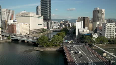 View-Overlooking-Kamiyanagi-Bridge-In-Hiroshima-With-Light-Traffic-Driving-Across-On-Sunny-Day-In-October,-2023