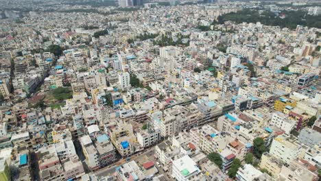 Bengaluru,-the-capital-of-Karnataka,-is-depicted-in-dramatic-aerial-footage-as-a-busy-residential-neighbourhood-encircled-by-single-family-homes-and-apartment-buildings