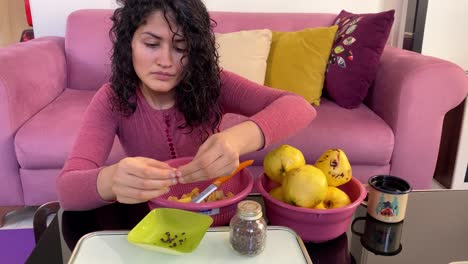 A-woman-work-at-home-slice-quince-wild-apple-fruit-in-small-pieces-the-concept-of-homework-work-at-home-housekeeping-woman-life-urban-living-in-big-city-in-Iran-Asia-America-Sweden-food-cuisine-Tehran