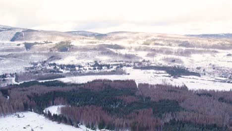 Panoramic-Aerial-View-Of-Snow-Covered-Ridges-And-Forest-In-Harz-Highlands,-Germany