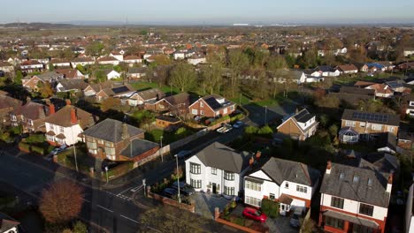Aerial-view-Wealthy-British-middle-class-houses-in-rural-suburban-neighbourhood-in-autumn