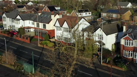 Aerial-view-expensive-British-middle-class-homes-in-rural-suburban-neighbourhood