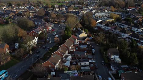 Rainhill-typical-British-suburban-village-in-Merseyside,-England-aerial-rising-view-over-Autumn-residential-neighbourhood