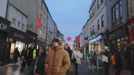 Decorations-and-street-with-shops-in-hyeprlapse-during-Christmastime-in-Cork-city,-Ireland