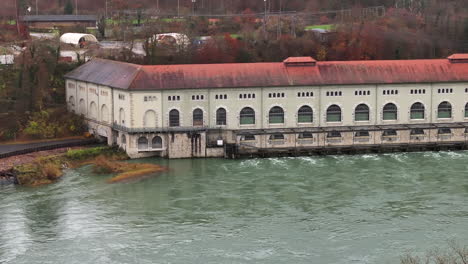 Hydro-powerhouse-Beznau-on-the-Aare-river-Switzerland,-drone-truck-4k