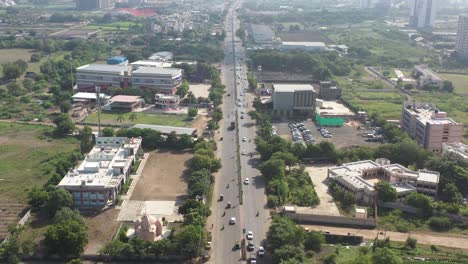 Rajkot-city-aerial-view-A-hotel-is-visible-next-to-the-talkies,-surrounded-by-large-trees