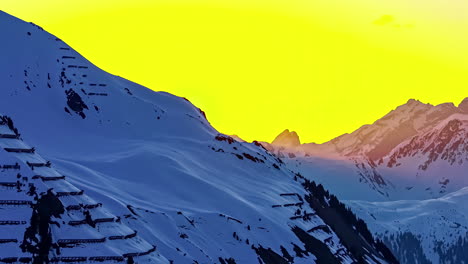 Golden-sky-over-snowy-mountain-landscape-in-a-winter-time-lapse