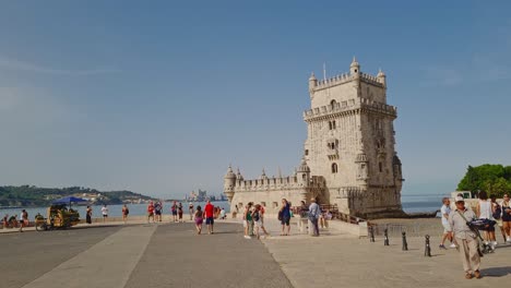 Tourists-daily-life-near-Belem-Tower,-a-popular-tourist-destination,-Lisboa,-Portugal