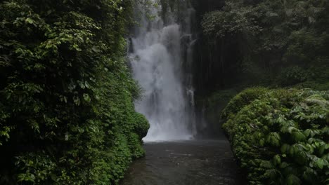 Powerful-gusts-of-wind-from-a-waterfall-in-the-depths-of-jungle-in-Bali,-Indonesia