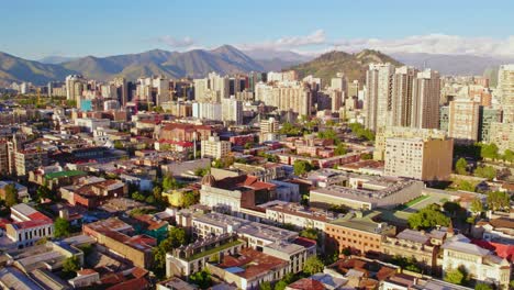 Aerial-establishing-shot-of-Brazilian-neighborhood-buildings-of-Santiago,-Island-hill-in-Background