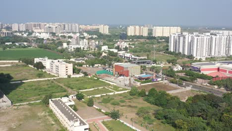 Rajkot-city-aerial-view-A-large-farm-is-visible-behind-the-Low-raise-houses
