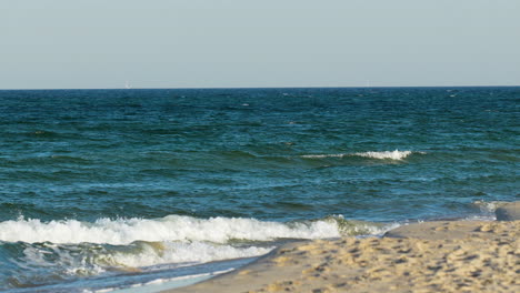Gentle-waves-crash-on-a-sandy-beach