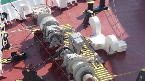 Reveal,-pulleys,-hoists-and-lots-of-shipping-equipment-on-deck-of-vessel