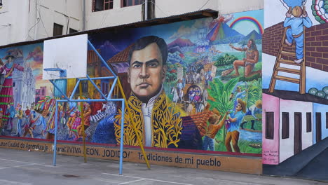 Pan-across-colorful-historical-mural-on-building-in-Leon,-Nicaragua