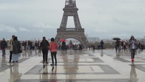 Tourists-in-Trocadero-Square-Films-Eiffel-Tower-in-the-Distance