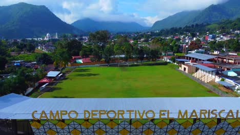 beautiful-aerial-view-with-drone-of-flying-overt-footbal-stadium-of-Chocaman-town,-Veracruz,-Mexico