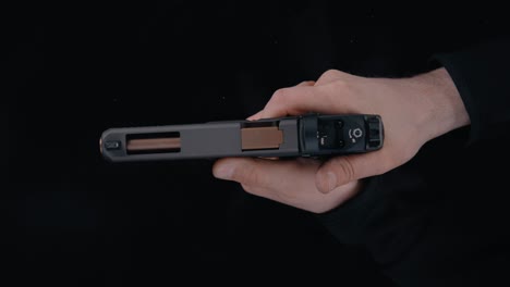 Person-Discharging-a-Handgun-with-Visible-Recoil
