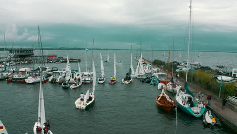 Drone-shot-of-yachts-preparing-to-start-in-regatta-race-in-Puck,-Poland