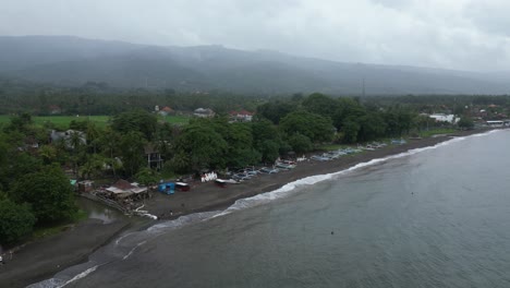 Moody,-overcast-sky-over-Lovina-in-the-North-of-Bali,-aerial