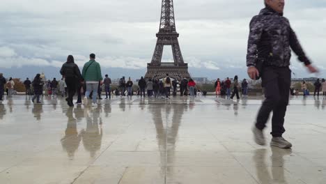 Asians-Male-Tourist-Stands-in-Trocadero-Square-and-Gazes-upon-Eiffel-Tower