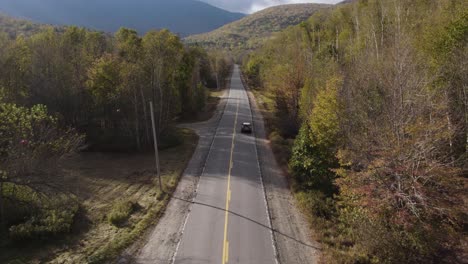 Scenic-Drive-On-Asphalt-Road-Through-Rural-Landscape-At-Grafton-Notch-State-Park-In-Maine,-USA