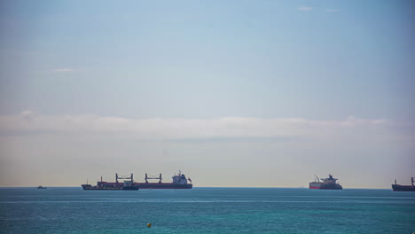 Time-lapse-shipping-charter-ships-off-the-coast-of-Algeciras,-Spain-and-Gibraltar