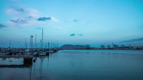 Time-lapse-port-harbour-with-boats-at-sunrise-with-clouds-moving-in-Spain