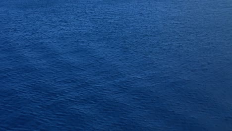 Windswept-ripples-spread-across-deep-blue-Carribean-ocean-water-currents-in-sea