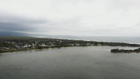 Aerial-drone-shot-towards-Shoalhaven-heads-on-a-stormy-day-in-south-coast-NSW-Australia