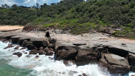 Nature's-Contrast:-Spoon-Bay's-Rocky-Coastline-Alongside-Wamberal-Beach,-an-Aerial-Snapshot-of-Central-Coast,-NSW