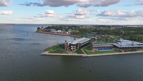 Great-aerial-view-of-the-Sebel-Hotel-on-the-shore-of-Lake-Mulwala-with-dead-trees-and-sunlight-beyond
