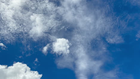 Speed-movement-of-white-clouds-against-blue-sky-on-sunny-day