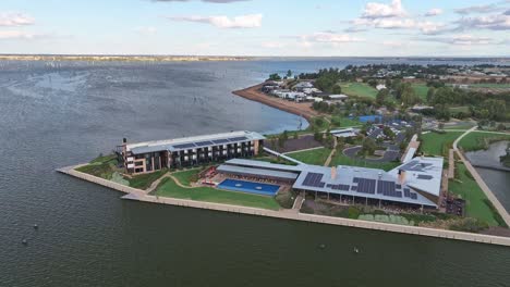 Aerial-wide-circular-view-of-the-Yarrawonga-Sebel-Hotel-with-Lake-Mulwala-and-dead-trees-beyond