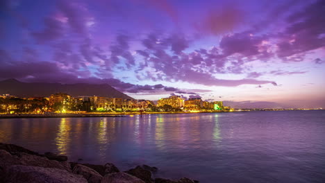 Transition-night-to-day-light-up-coast-and-sea-of-Malaga,-Spain-with-sunrise