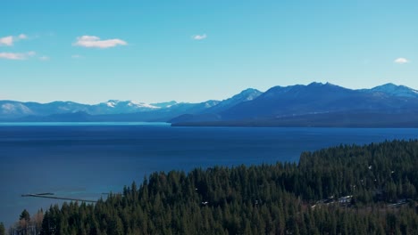 Drone-Aerial-shot-down-the-coast-of-Lake-Tahoe-on-a-sunny-day