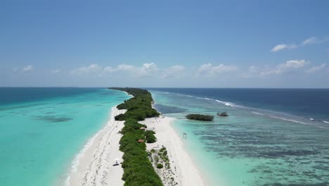 Aerial-above-Long-lush-sanbar-amid-vast-blue-lagoon-on-Dhigurah-island,-Maldives