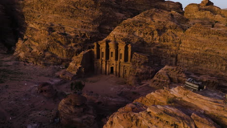 Tent-On-Rock-Formation-With-View-Of-Ad-Deir-Monastery-At-Sunset-In-Petra,-Jordan
