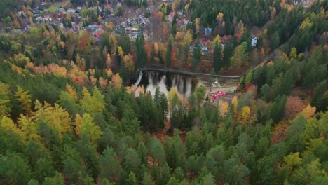 Karpacz,-Poland,-Łomnica-Dam-drone-move-down,-tilt-up-view,-autumn-scenery