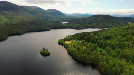 Scotland's-Wild-Heart:-An-Aerial-Exploration-of-Loch-An-Eilein-and-Castle-Amidst-the-Cairngorms'-Scots-Pine-Forest,-Aviemore,-UK
